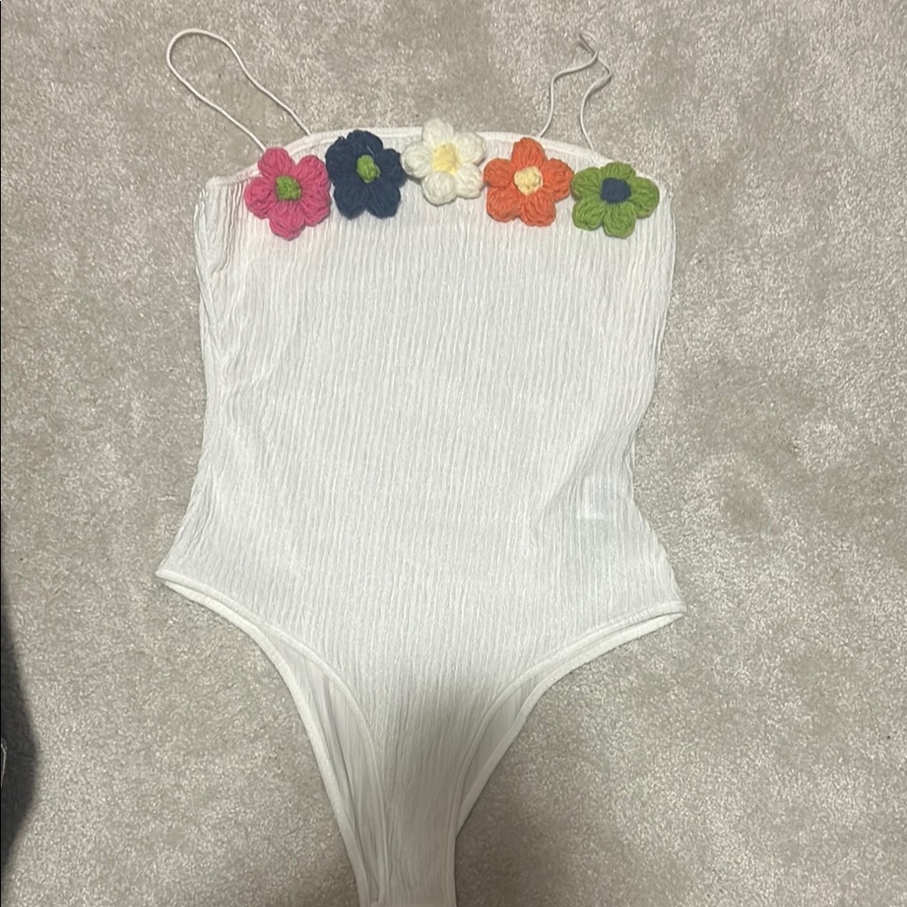 NWOT White and Pink Floral Bodysuit with High-Cut Design NWOT